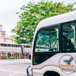 The Boobook 4WD bus driving towards the School of Arts, Roma