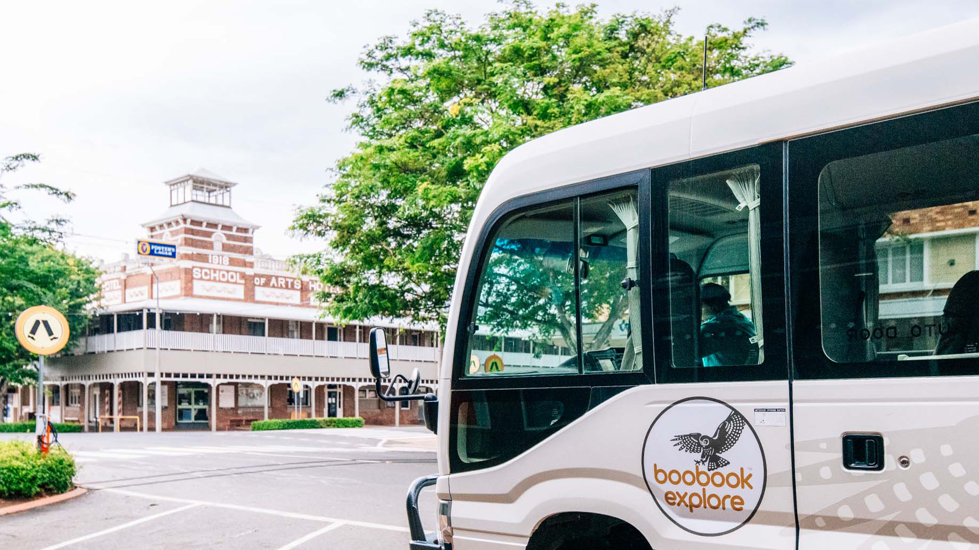 The Boobook 4WD bus driving towards the School of Arts, Roma