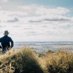 Two people looking out at a landscape below