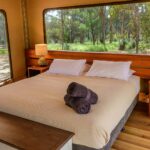 Queen bedroom inside a glamping tent