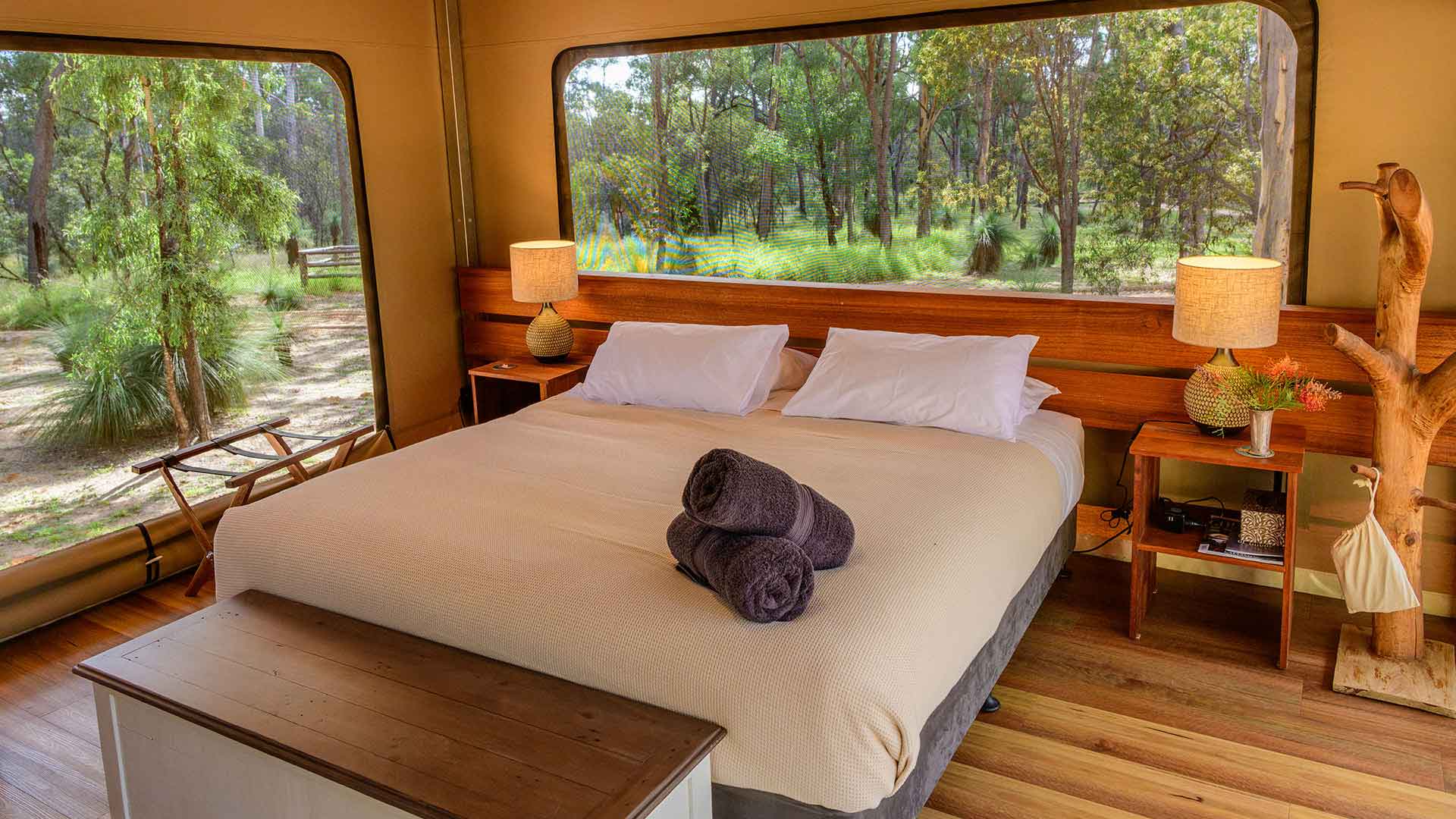 Queen bedroom inside a glamping tent