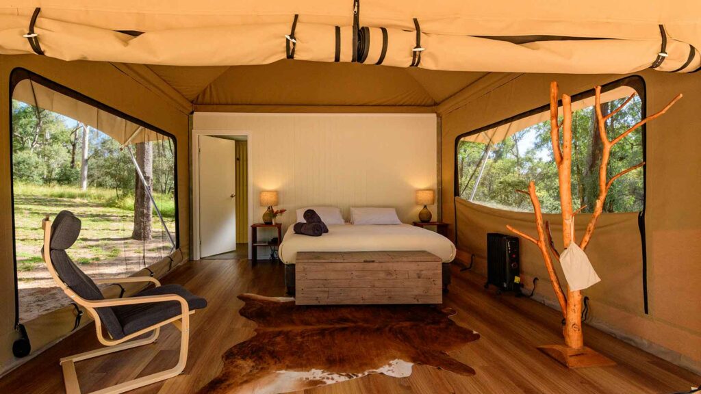 Queen bedroom inside glamping tent