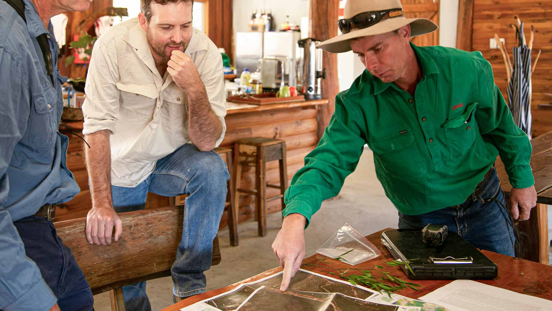 two people looking at a map, planning their journey