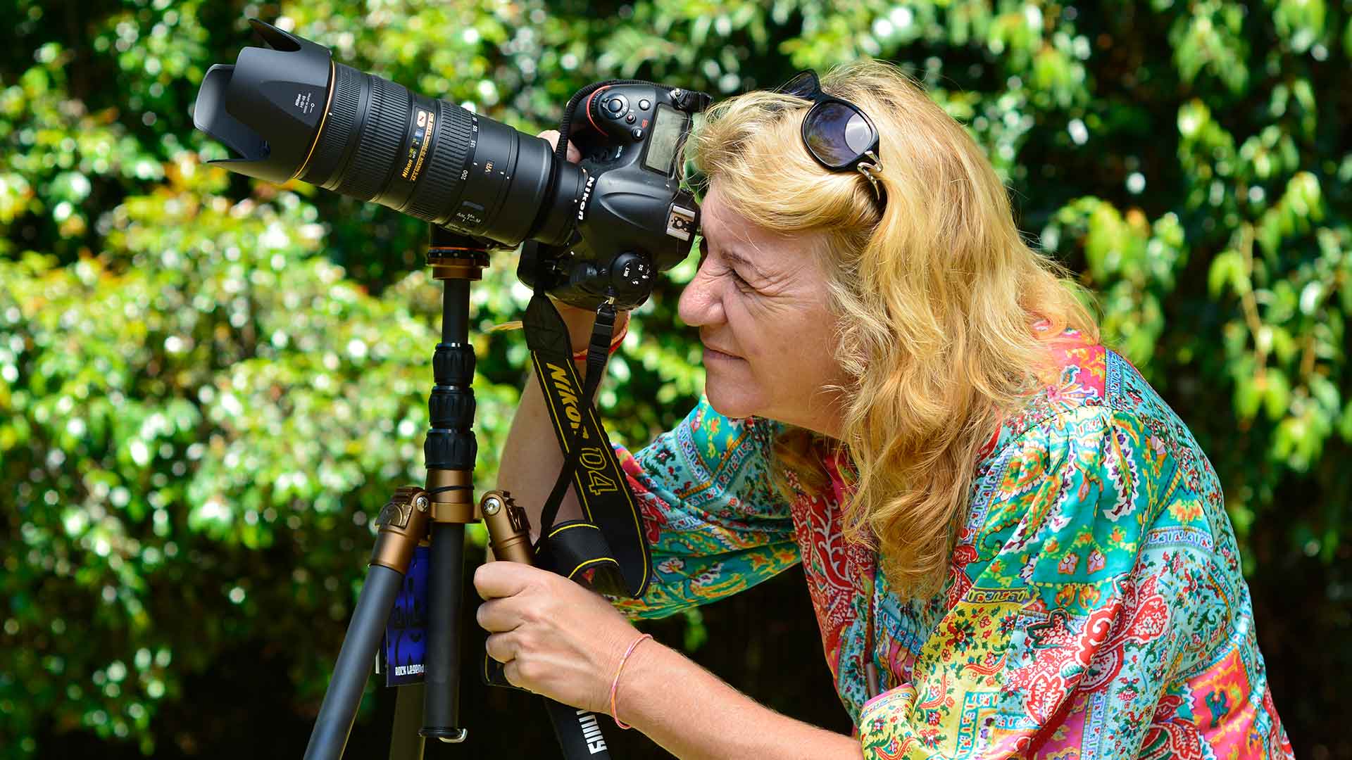 Danielle Lancaster photographer looking through an SLR camera