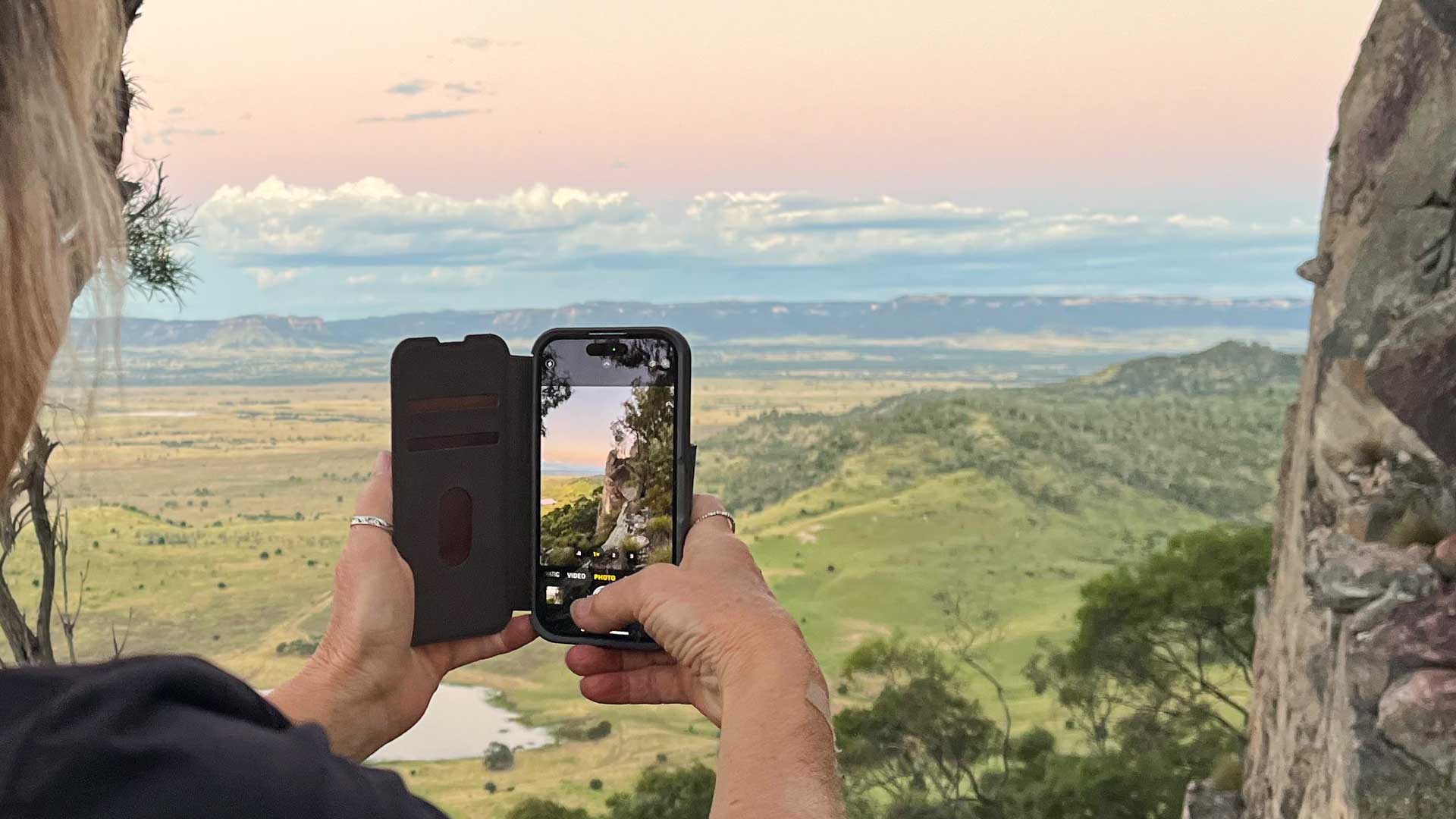 Close-up of smart phone with landscape image in view finder