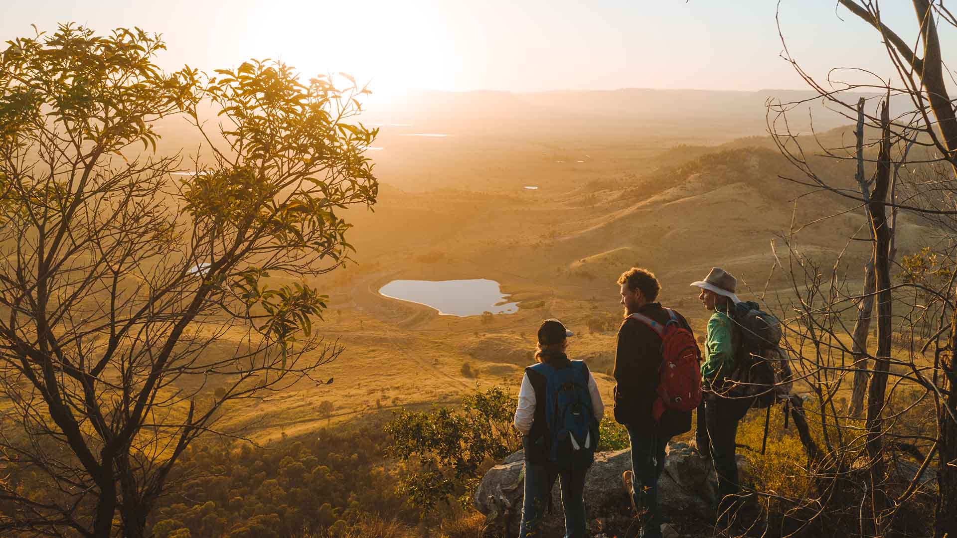 A group of guests looking out at Arcadia Valley as the sun sets